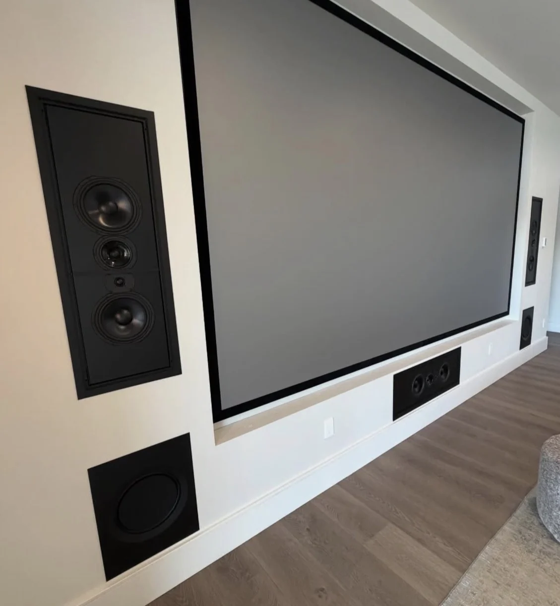 Real finished custom home theater with projection screen and built-in speakers