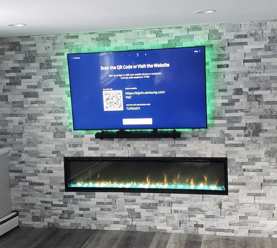 Commercial AV installation with conference display, video conferencing, speakers, access control, and equipment rack